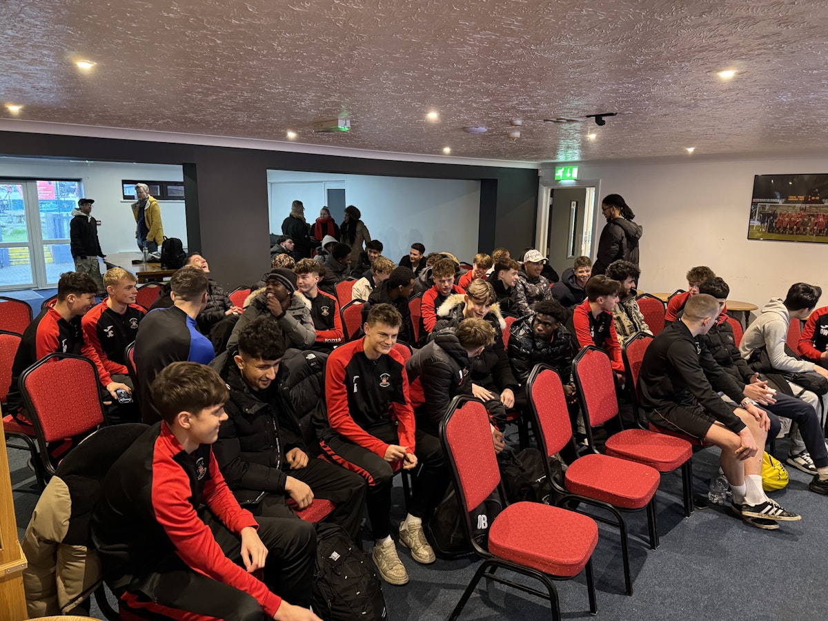 Needham Market Academy players and young South Sudanese and Iraqi men getting to know eachother